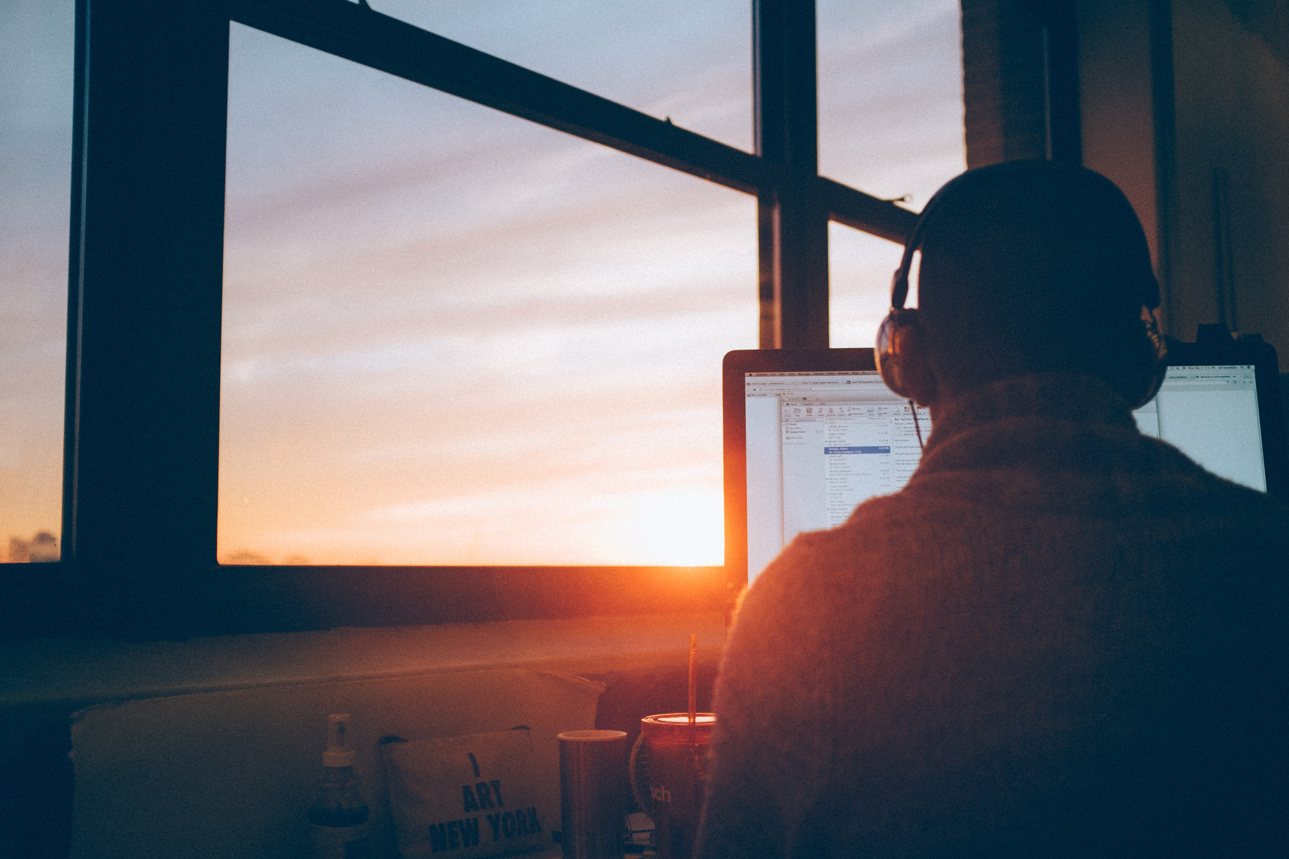 Person doing online tech support with headphones