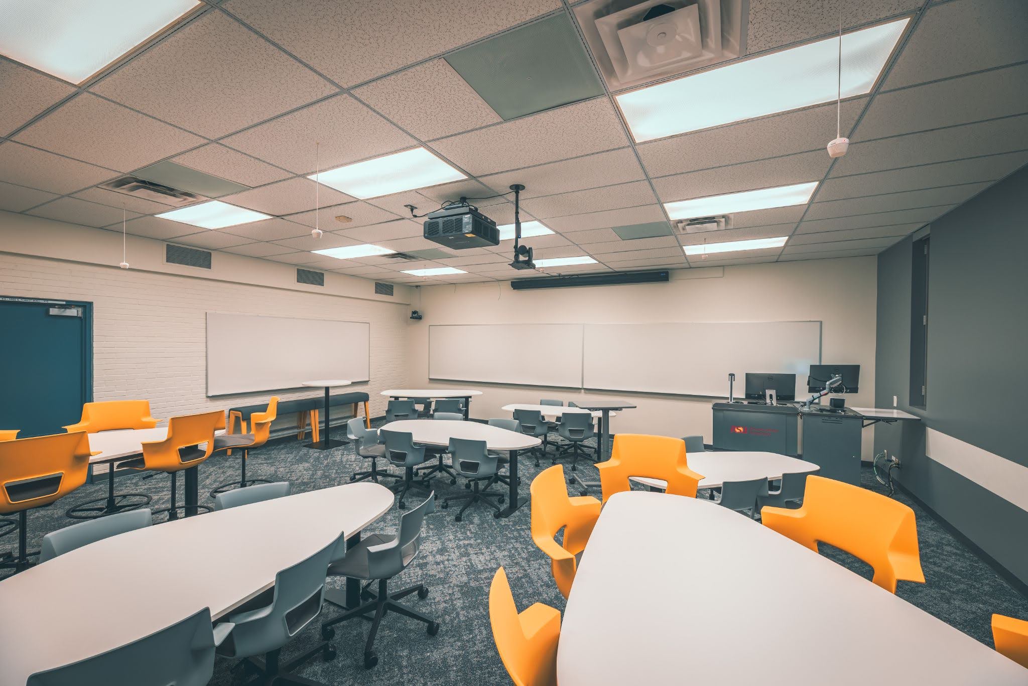 wide view of a classroom with collaborative group seating