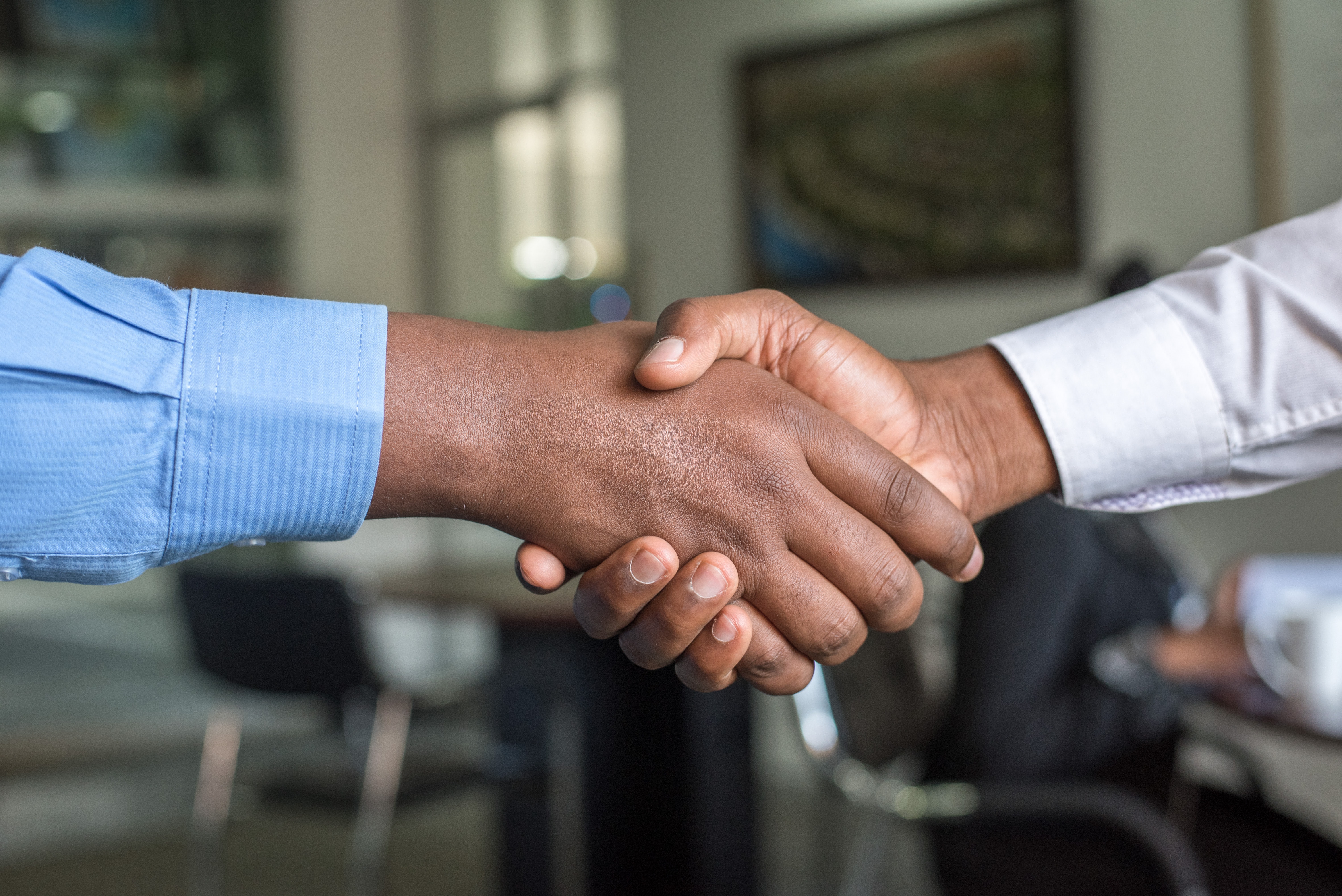 handshake between two employees